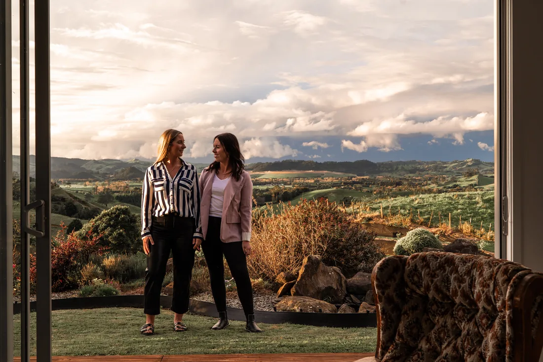 On site with clients at a property at golden hour.