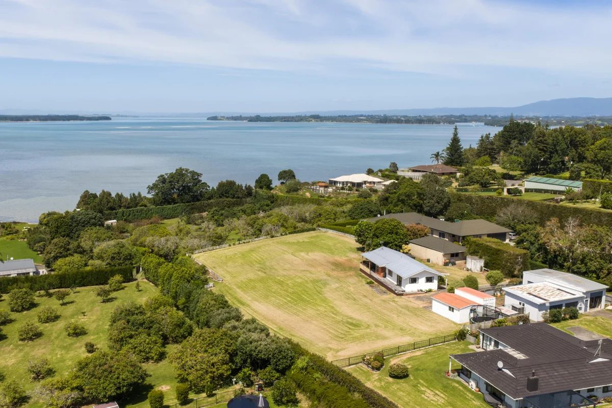 The property above the Athenree estuary, neighbours alongside