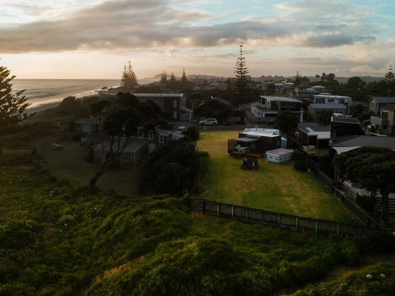 The site and surrounding bachs in golden evening light
