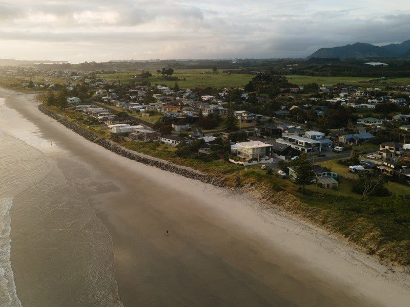 Waihi Beach and the estuary stretching north at dusk