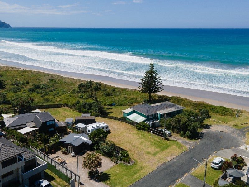 Beachfront homes and the long northern beach from above