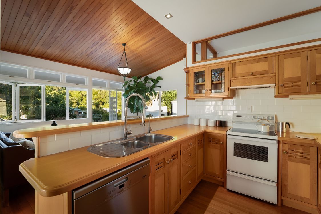 The timber kitchen with island and full appliances
