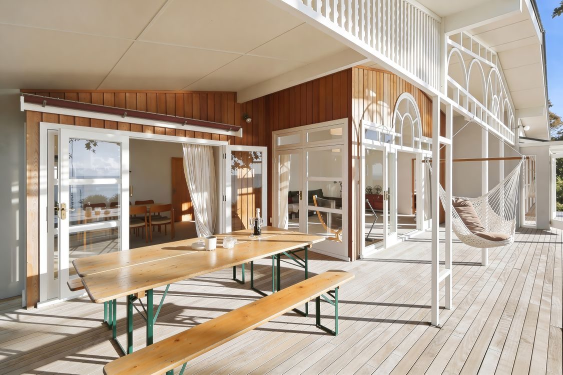 The covered outdoor deck and table