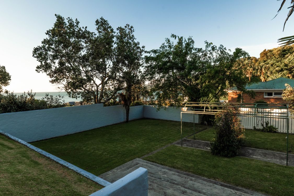 The lawn and grounds, the sea and an island beyond